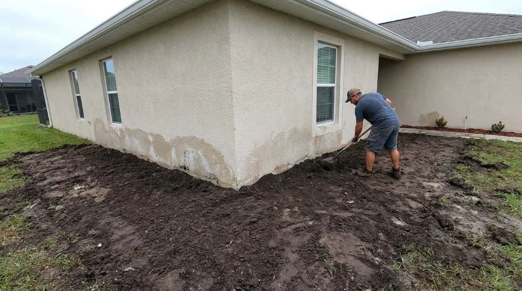 Residential yard grading designed to prevent standing water