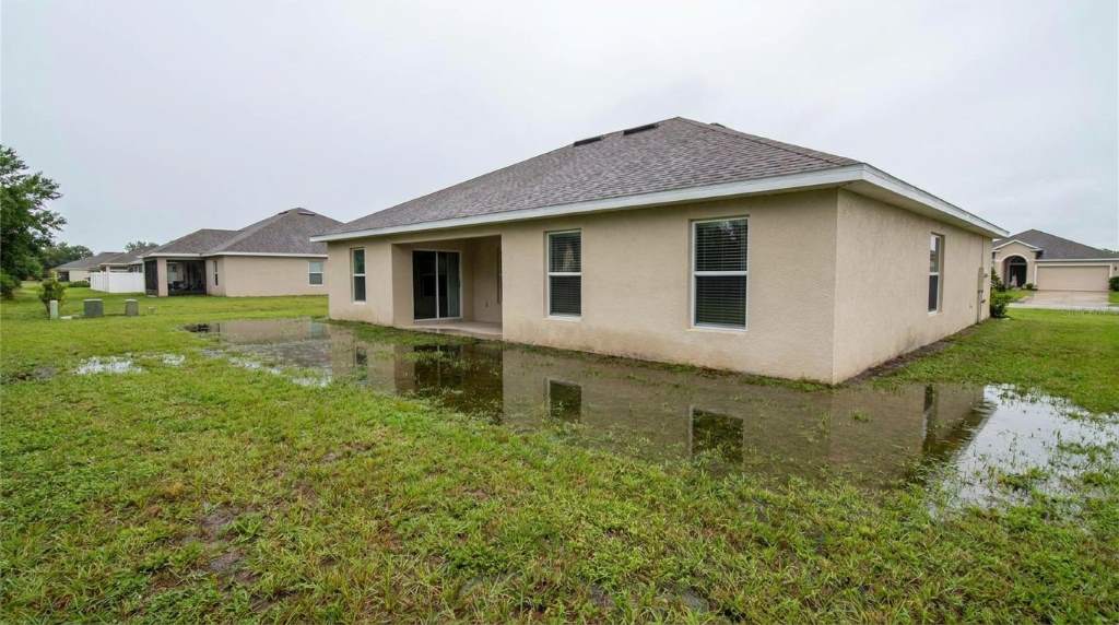 Water ponding beside a Lakeland Florida home after heavy rain